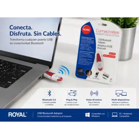 Adaptador USB Bluetooth Royal Connect-ables color rojo y blanco conectado a una laptop gris para sincronización de dispositivos inalámbricos.